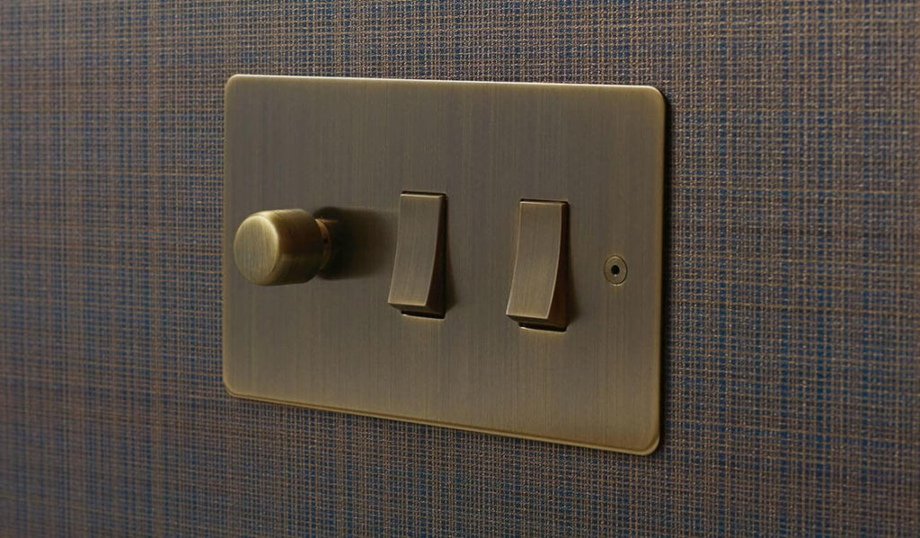 Horizon Classic combination lighting control switch, Antique Brass.