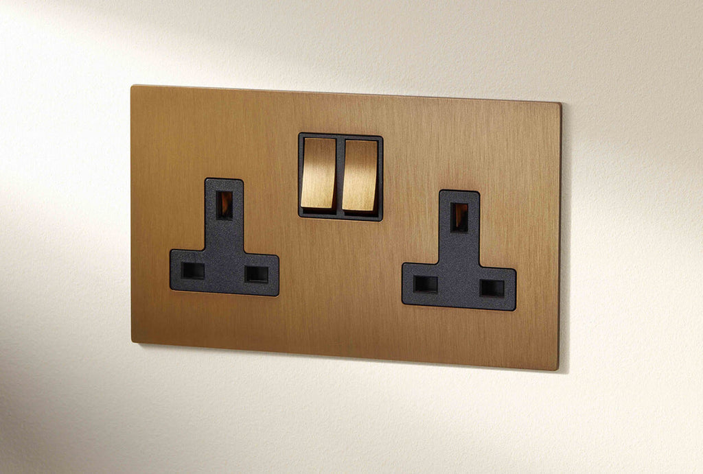 Image: Renaissance 2G rocker low profile flat screwless plate with black trimmed matching switches in Sienna finish with Graphenstone GrafClean White Linen background