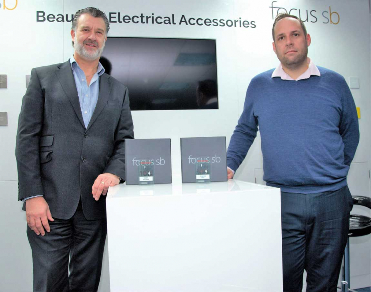 Image caption (from left to right): Gary Stevens, managing director, with Duncan Ray, supply chain and NPI manager, pictured with their Top 100 trophies in Focus SB’s showroom in St Leonards on Sea, East Sussex.