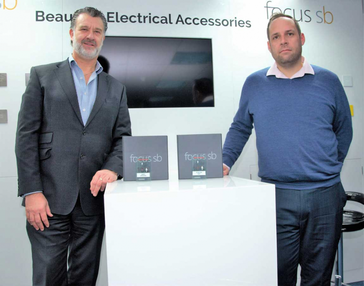 Image caption (from left to right): Gary Stevens, managing director, with Duncan Ray, supply chain and NPI manager, pictured with their Top 100 trophies in Focus SB&rsquo;s showroom in St Leonards on Sea, East Sussex.