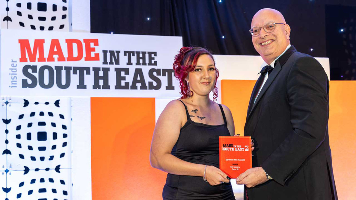 Anni accepts award from judge Mr Paul Hetherington, strategic advisor BRE Group