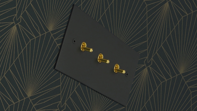 True Edge finished in matt black, with satin brass Contemporary toggle switches.
