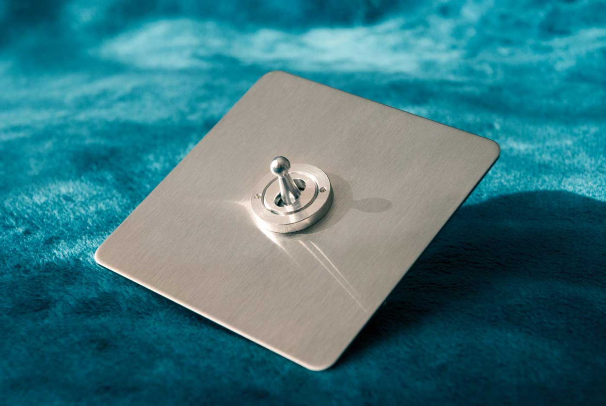 Ambassador Classic double throw centre off retractive toggle grid switch, satin stainless finish.